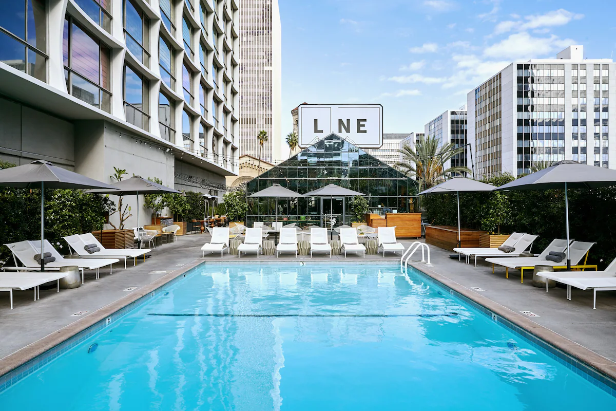 The Line pool LA - Bronson Hospitality Luxury pool area at The LINE Los Angeles, offering a modern and relaxing atmosphere in the heart of the city. Surrounded by stylish lounge seating, contemporary architecture, and vibrant urban views, this space provides the perfect setting for leisure, social gatherings, and upscale hospitality experiences.