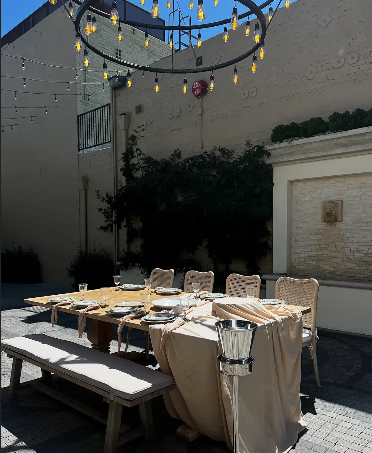 Serra on Vine outdoor courtyard filming location with dining setup and string lights, Hollywood